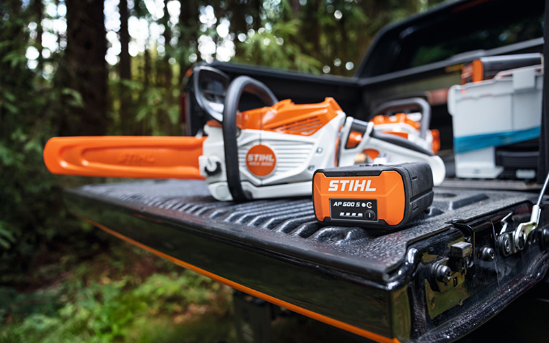 STIHL Chainsaw and STIHL battery on the trailer of a black Ute